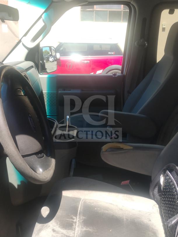 2010 Ford E350 Commercial Cargo Van interior; visible wear, clear title, odometer 162,472. Runs and drives.