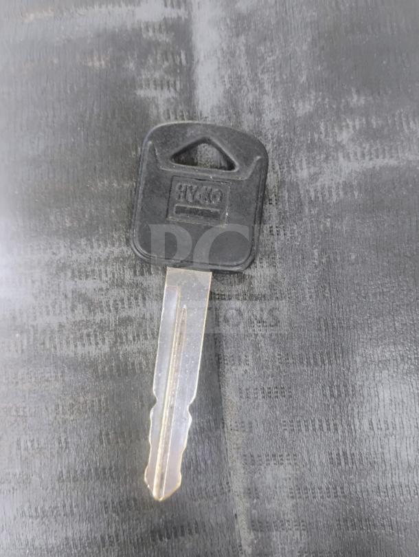 Key for 2010 Ford E350 Commercial Cargo Van. Black plastic head with "HY-KO" label.
