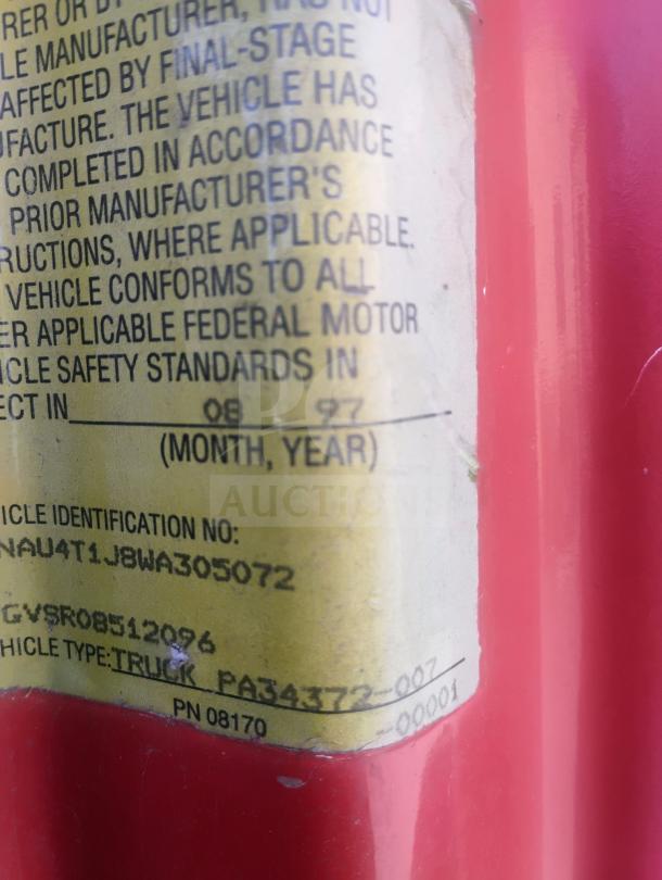 Close-up of a vehicle identification label on a 1998 UD International Cab-Over Refrigerated Box Truck.