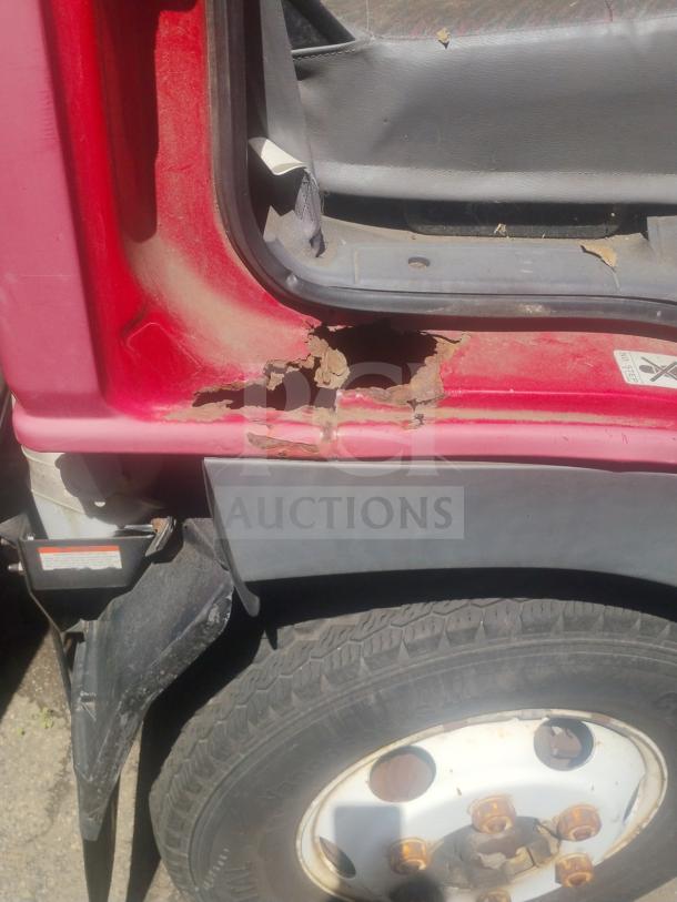 1998 UD International Cab-Over Truck showing rust on red door near tire. Clear title. Odometer: 103,180 miles.