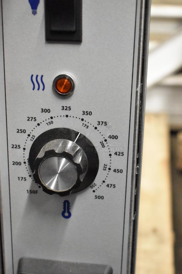 Close-up of thermostatic controls on a Garland MCO-GS-10S convection oven. Temperature knob shows temperatures from 150°F to 500°F.