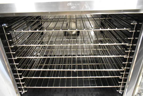 Brand new Garland MCO-GS-10S convection oven, stainless steel, view-through doors, metal racks, thermostatic controls.