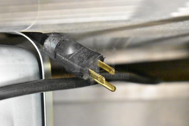 Electrical plug of Garland MCO-GS-10S convection oven, natural gas powered, shown in close-up.