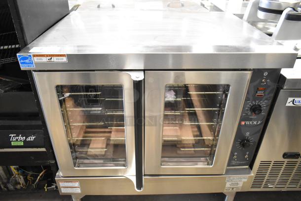 Brand new Wolf WC4GD-11D3 stainless steel convection oven, 50,000 BTU, view-through doors, thermostatic controls.
