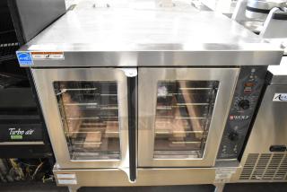 Brand new Wolf WC4GD-11D3 stainless steel convection oven, 50,000 BTU, view-through doors, thermostatic controls.