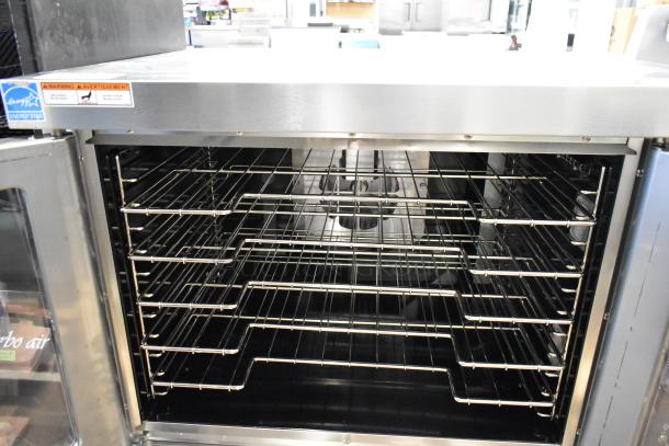 Brand new Wolf WC4GD-11D3 stainless steel convection oven, features view-through doors, metal racks, 50,000 BTU.