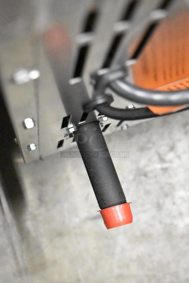 Stainless steel part of Wolf WC4GD-11D3 convection oven, showing close-up of surface and assembly with visible screws.