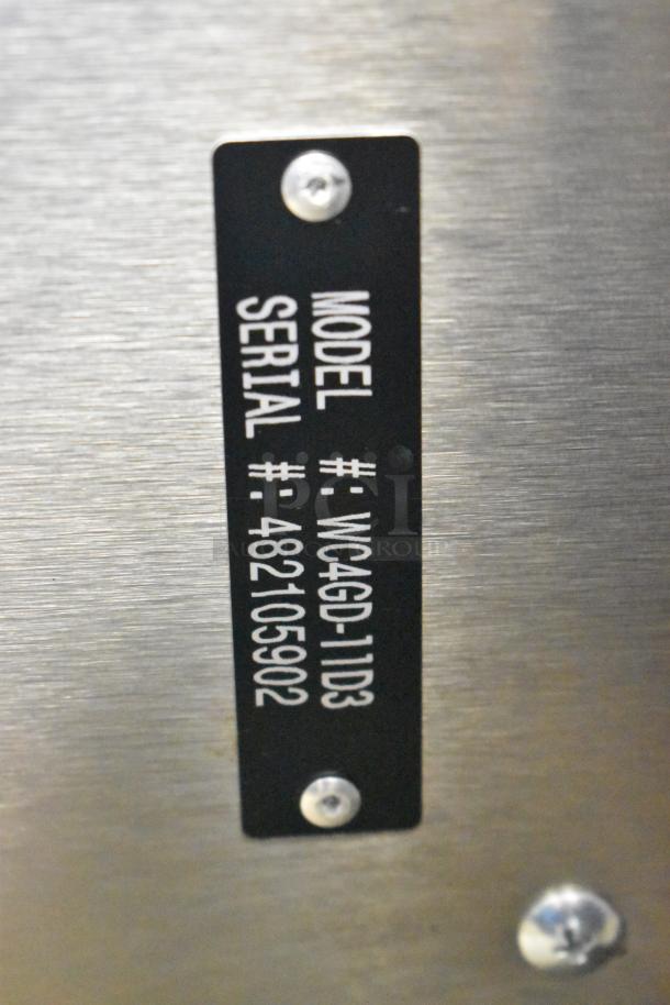 Label on Wolf WC4GD-11D3 convection oven, model and serial numbers visible, stainless steel finish.