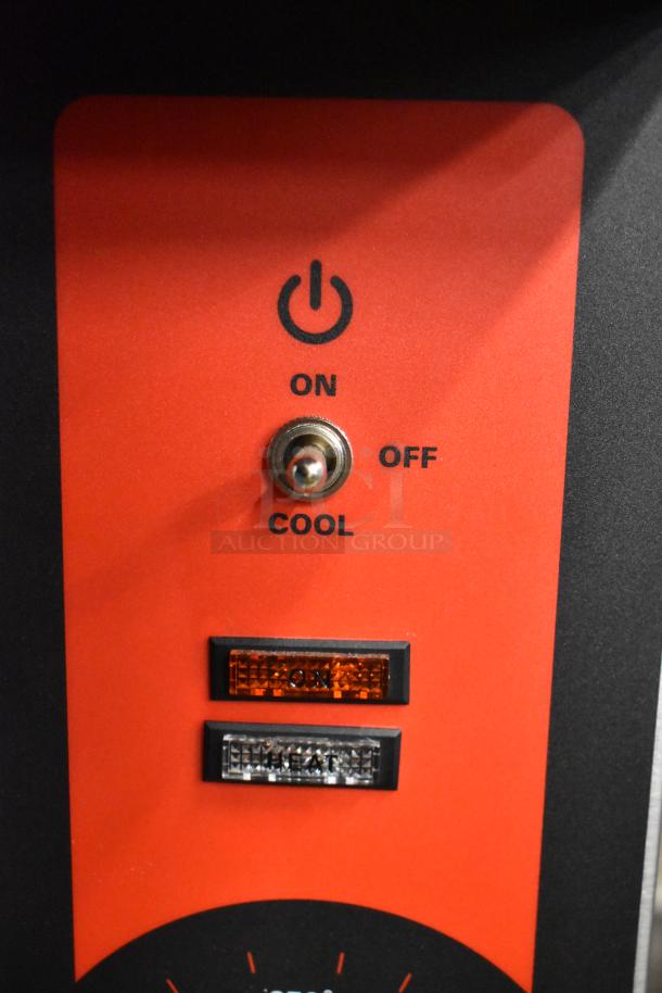 Toggle switch on Vulcan convection oven control panel with on/off/cool settings and indicator lights.