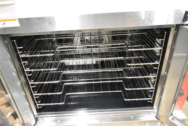 Vulcan stainless steel convection oven, brand new scratch and dent, full size, with view-through doors and metal racks.