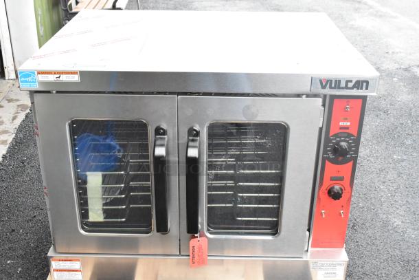 Brand new Vulcan VC5GD-11D1Z stainless steel commercial gas convection oven with view-through doors, metal racks, and thermostatic controls.