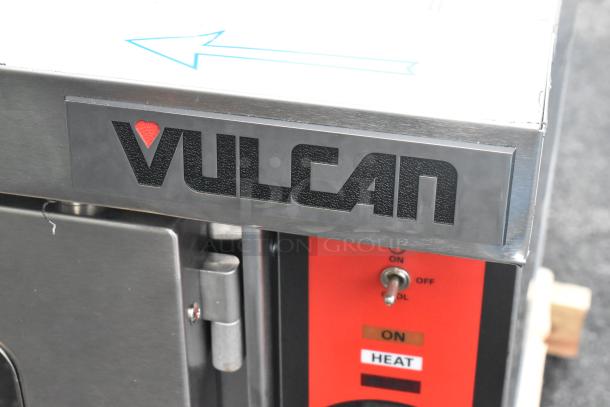 Brand new Vulcan VC5GD-11D1Z stainless steel convection oven, featuring view-through doors, metal racks, and thermostatic controls.
