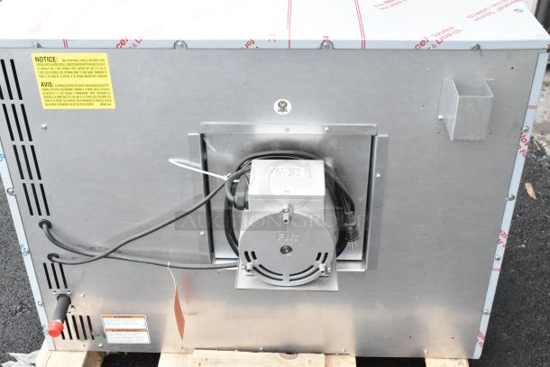 BRAND NEW Vulcan VC5GD-11D1Z stainless steel convection oven, gas-powered, with motor and wiring visible. Scratch and dent condition.