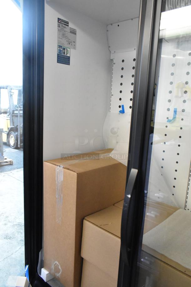 2025 True FLM-81 Metal 3-Door Commercial Cooler. Brand new with minor scratches and dents. 115 Volts, 1 Phase.