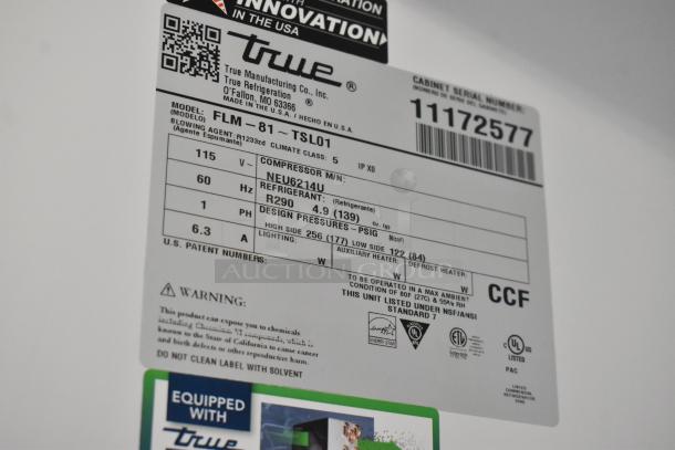 Label showing specifications for True FLM-81 Commercial 3 Door Reach In Cooler. Includes model, voltage, and refrigerant details.