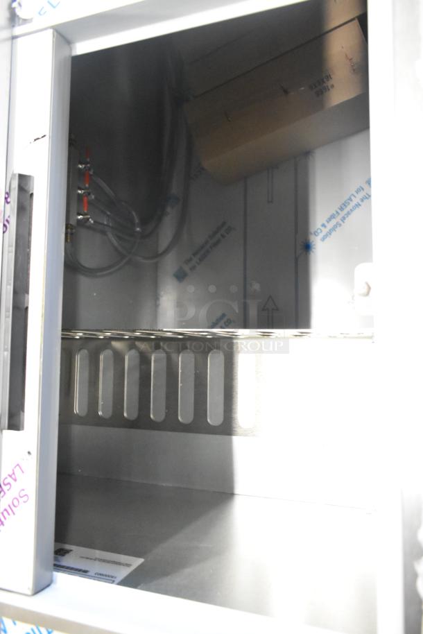 Beverage Air DD68HC-1-C-B kegerator interior view, stainless steel finish, equipped for three 1/2 keg capacity.