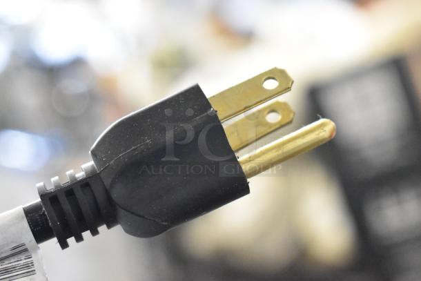 Close-up of a three-pronged electrical plug for the 2025 Manitowoc SPA312-161 Touchless Hotel Ice Dispenser.