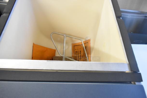 Stainless steel Scotsman HD22B-1H commercial ice dispenser, 120 lb. capacity, 2025 model, interior view, new condition.