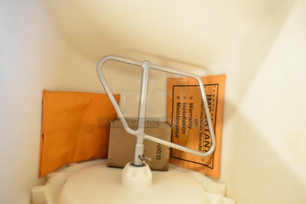 Brand new 2025 Scotsman HD22B-1H ice dispenser interior. Includes warranty and installation info packet.