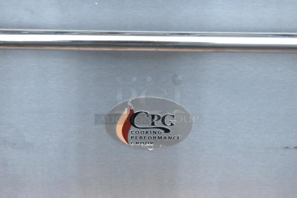 Stainless steel front panel of Cooking Performance Group range with logo and scratched surface.