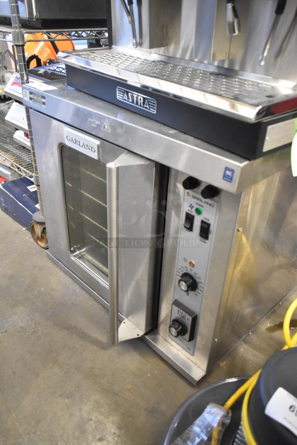 Garland Master 200 stainless steel convection oven with view-through door, metal racks, and thermostatic controls.