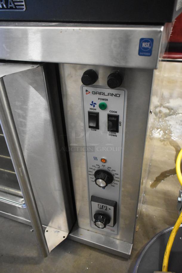 Garland Master 200 stainless steel convection oven with view-through door, metal racks, and thermostatic controls, NSF certified.