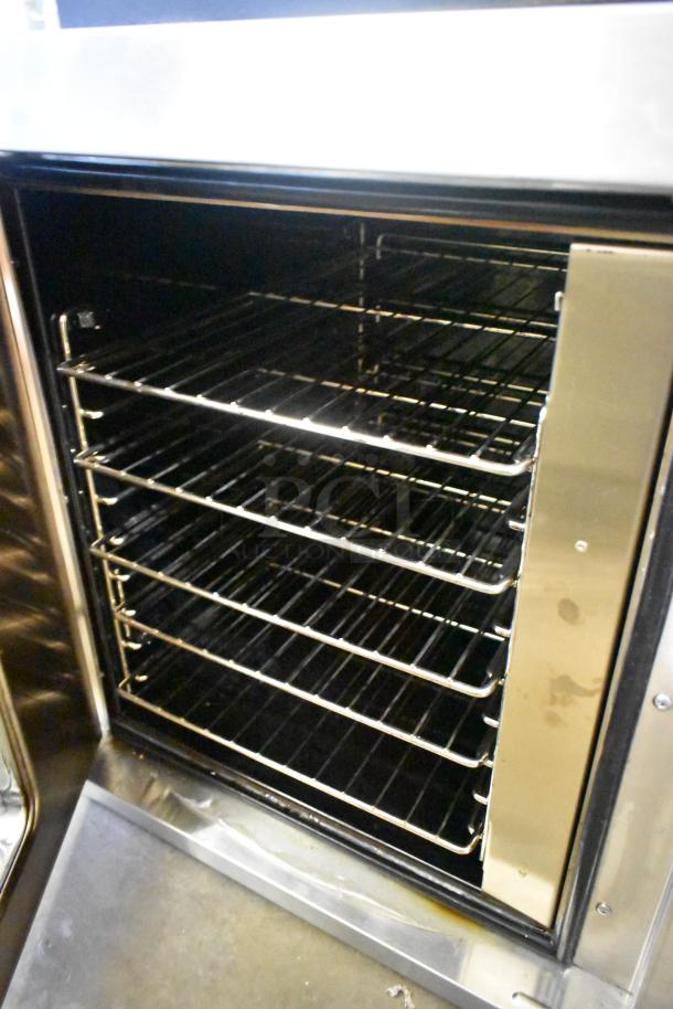 Garland Master 200 stainless steel convection oven with view-through door, metal racks, and thermostatic controls.