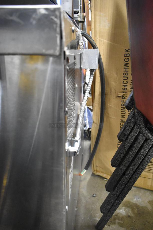 Garland Master 200 stainless steel commercial convection oven, side view. Includes metal oven racks and thermostatic controls.