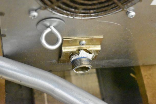 Close-up of a connector on a 2024 Blodgett DFG-50 stainless steel convection oven. Note the scratch and dent.