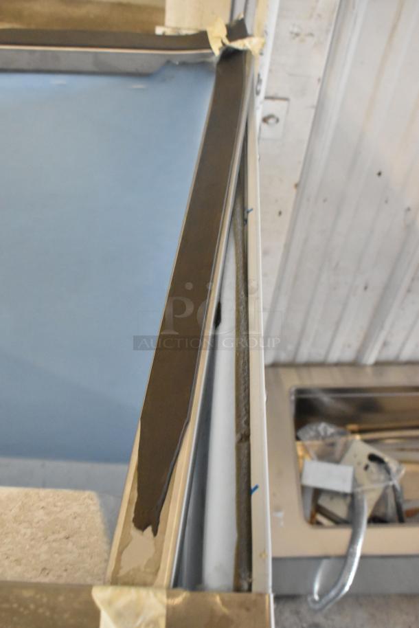 Brand new Hoshizaki B-900SF stainless steel ice storage bin, 52" wide, 900 lb capacity, minor scratches and dents visible.