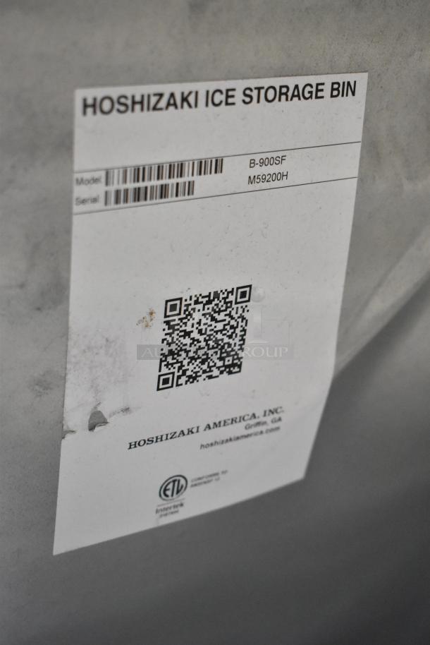 BRAND NEW Hoshizaki B-900SF Stainless Steel Commercial Ice Storage Bin, 52", 900 lb capacity. Scratch and dent condition. Model info and QR code visible.