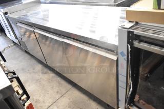 Brand new Avantco 178SSUD3R stainless steel commercial 3-door undercounter cooler, 115V, casters, right door detached.