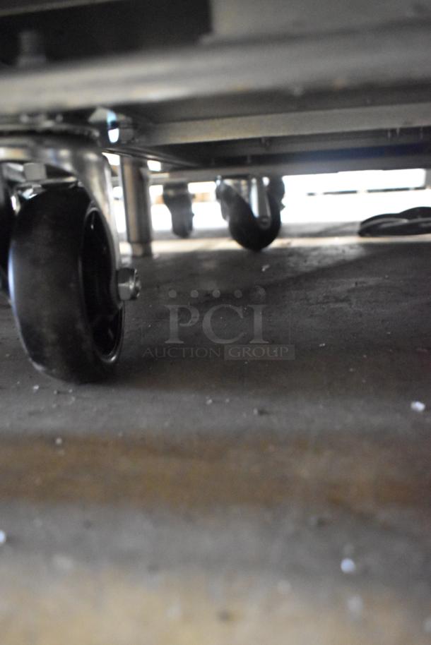 2025 Avantco 178SSUD3R 3-door undercounter cooler with casters. New with scratches, right door detached. 115V, 1 phase.