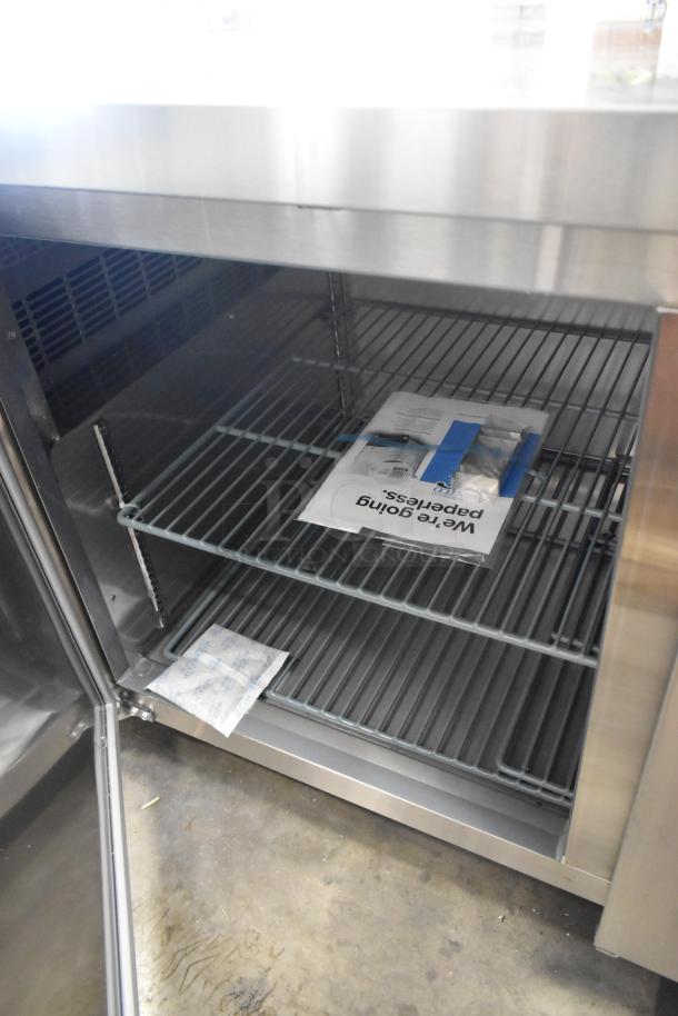 Avantco 178SSUD3R stainless steel 3-door undercounter cooler, brand new, scratch and dent, right door detached, on casters.