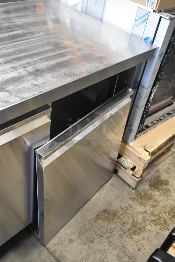 Avantco 178SSUD3R stainless steel 3-door undercounter cooler, new, scratch and dent; right door unattached; on casters.