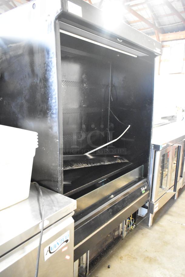 Turbo Air TOM-50B-SP-A-N metal commercial reach-in merchandiser, black, 115V, 1 phase, moderate wear, spacious interior.