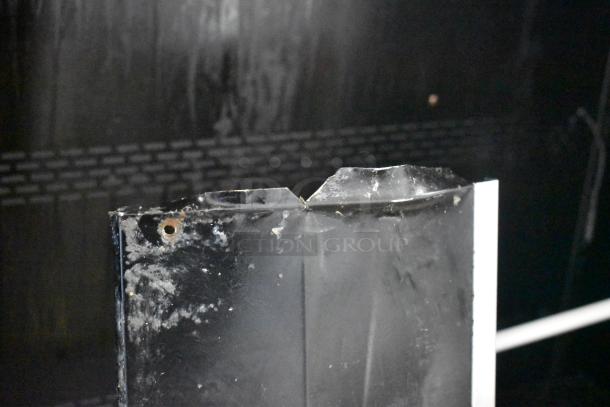 Broken section of Turbo Air TOM-50B-SP-A-N merchandiser. Damage evident, suggests repair needed. 115 Volts, 1 Phase.