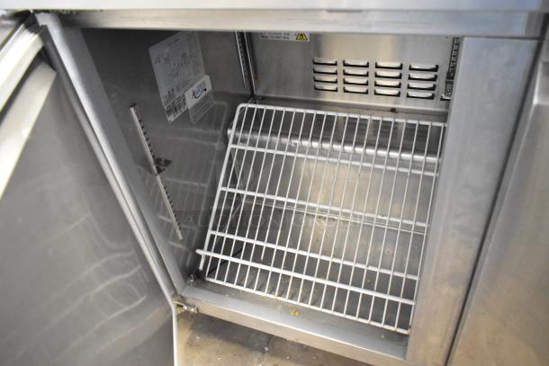 Avantco 178SSWT48FHC stainless steel 2-door undercounter cooler with commercial casters, interior shelf, 115V, 1 Phase.