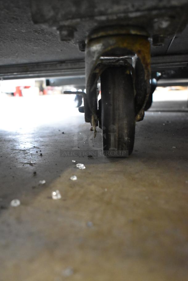 Avantco 178SSWT48FHC undercounter cooler caster, showcasing sturdy commercial design.