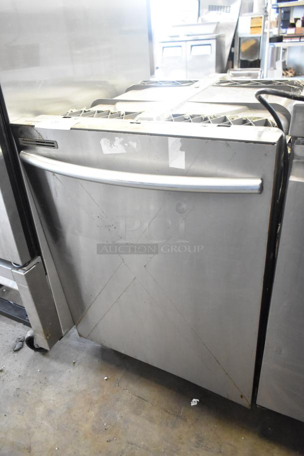 Samsung DW80M2020US stainless steel dishwasher, undercounter model, visible wear, 115 volts, 1 phase.