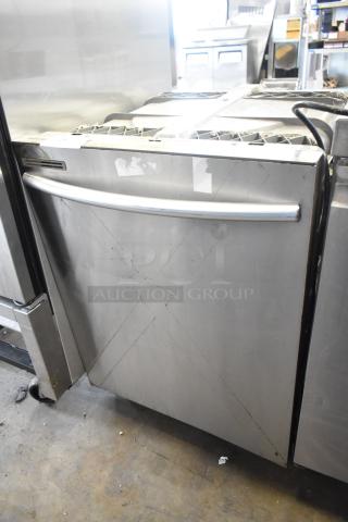 Samsung DW80M2020US stainless steel dishwasher, undercounter model, visible wear, 115 volts, 1 phase.