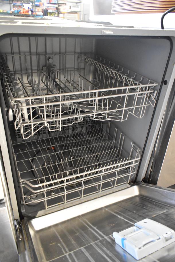 Samsung DW80M2020US stainless steel undercounter dishwasher, open view. Dual racks, 115V, 1 phase, in good condition.