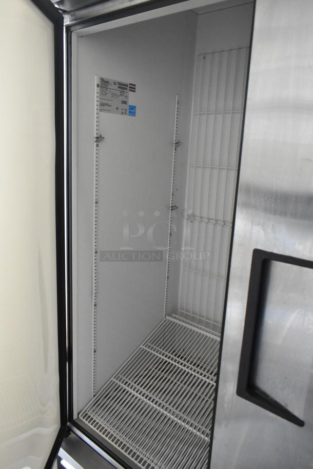 True T-72F stainless steel 3-door commercial freezer with poly-coated racks, commercial casters, 115V, 1 phase.