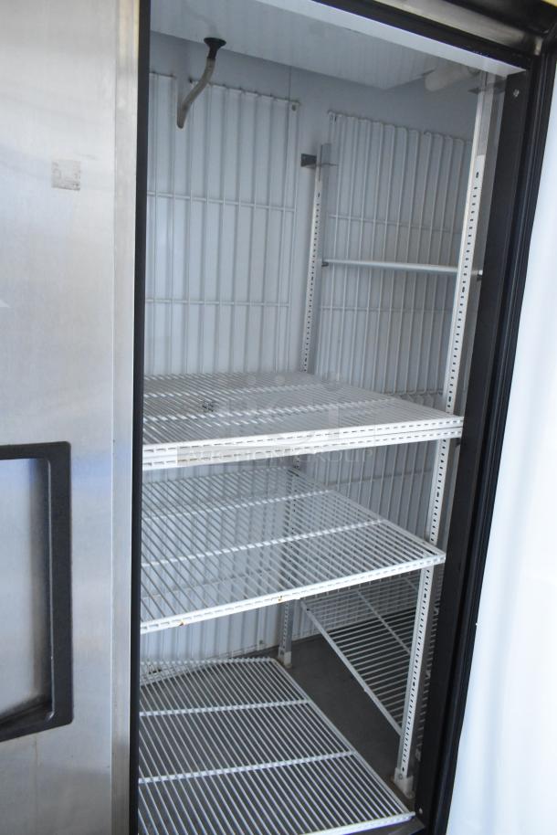 True T-72F stainless steel 3-door commercial freezer with poly coated racks, on commercial casters. 115 volts, 1 phase.