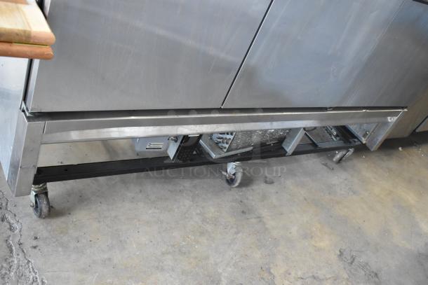 True T-72F stainless steel 3-door commercial freezer on casters, with poly-coated racks, 115V, 1 phase; in used condition.