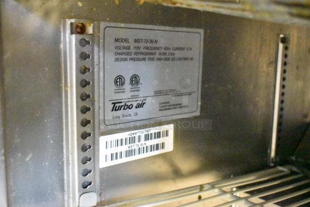 Turbo Air MST-72-30-N label, showing 115V, 1 Phase, ETL certified. Stainless steel commercial prep table specs displayed.