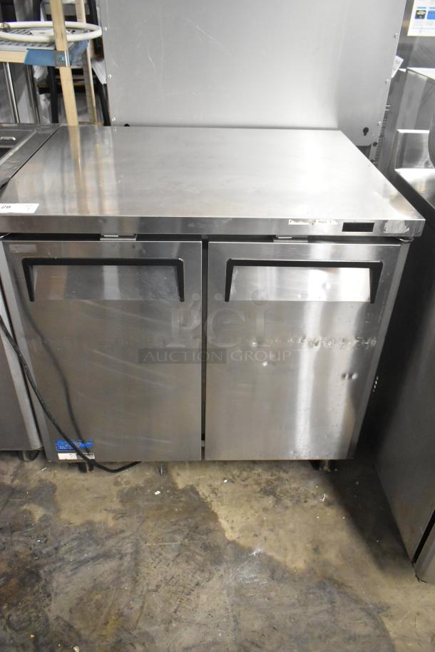 Turbo Air MUF-36-N stainless steel 2-door undercounter freezer on commercial casters, 115V, 1 phase. Visible used condition.