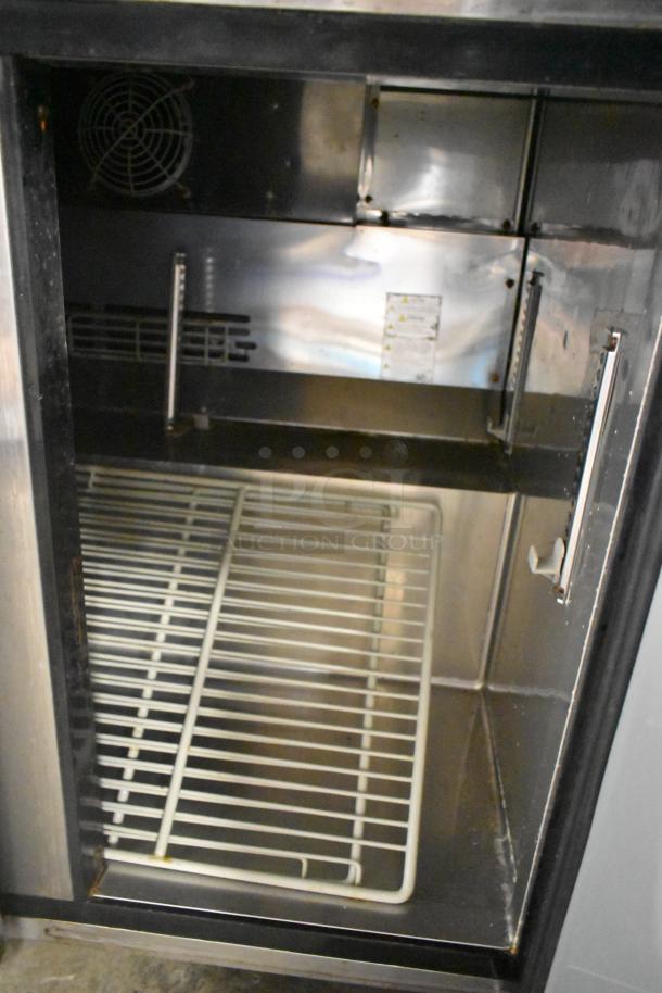 Turbo Air MUF-36-N stainless steel undercounter freezer, 2 doors, on commercial casters, interior view, 115V, 1 phase.