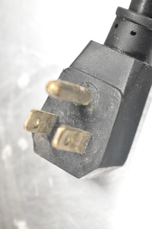 Close-up of a black electrical plug for the Turbo Air TWR-72SD-N commercial cooler, showing standard prongs.