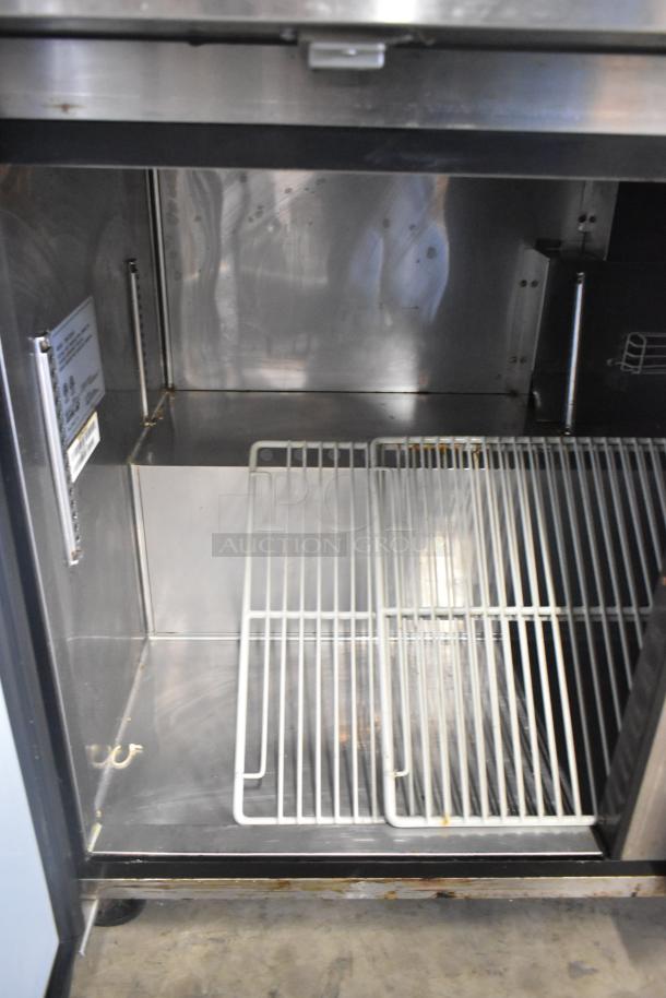 Turbo Air TWR-72SD-N stainless steel 3-door work top cooler, interior view, on commercial casters, 115V, 1 Phase.